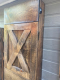 Close up of handcrafted Murphy Bench in closed position showing oil rubbed bronze latch and solid wood cross hatch design of bench leg