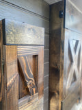 Close up view of Handcrafted Murphy Dining Table and Benches in closed position showing solid wood cross hatch design of legs and rustic metal braces and locking latches to keep in closed hanging position
