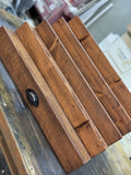 Front view of handcrafted solid wood fragrance display shelf with large storage drawer in special walnut finish and oil rubbed bronze drawer pull